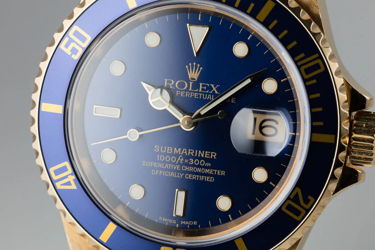 1999 Rolex 18K YG Submariner Blue Dial with Box and Papers