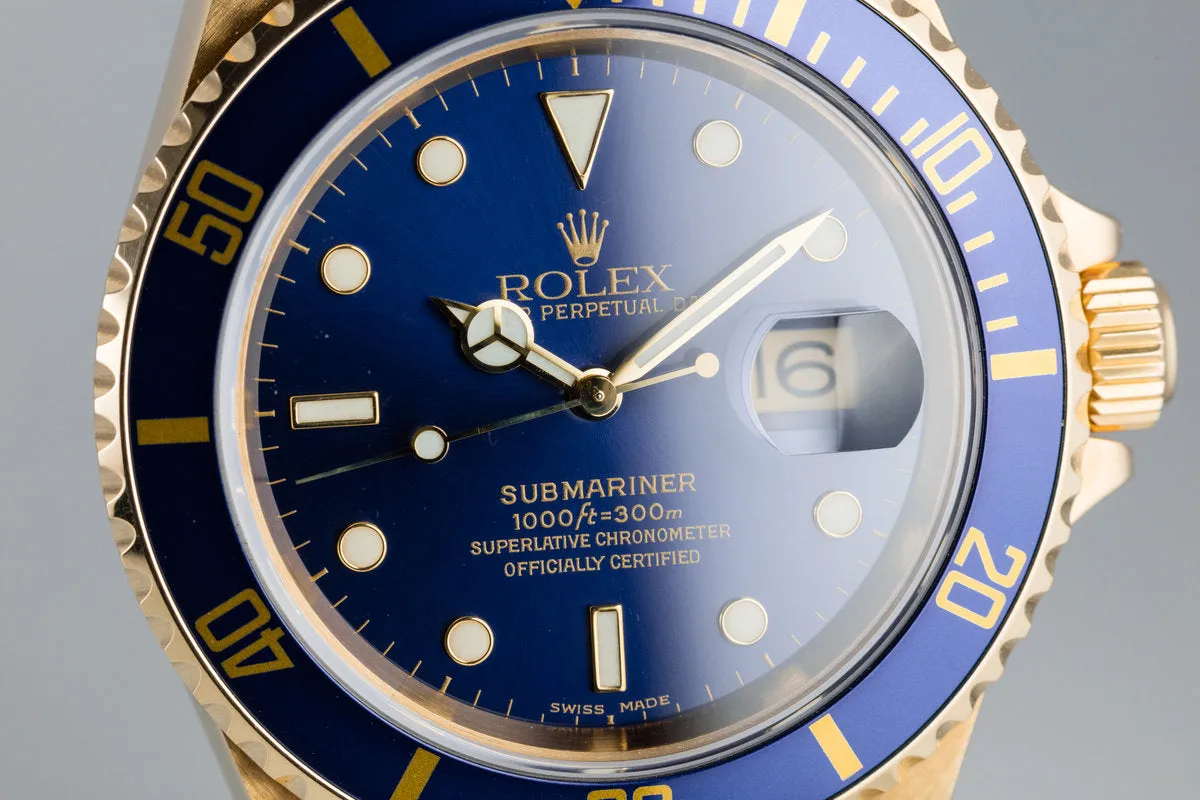 1999 Rolex 18K YG Submariner Blue Dial with Box and Papers